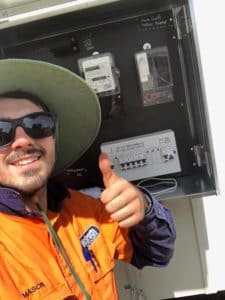 electrician showing thumbs up outside power board