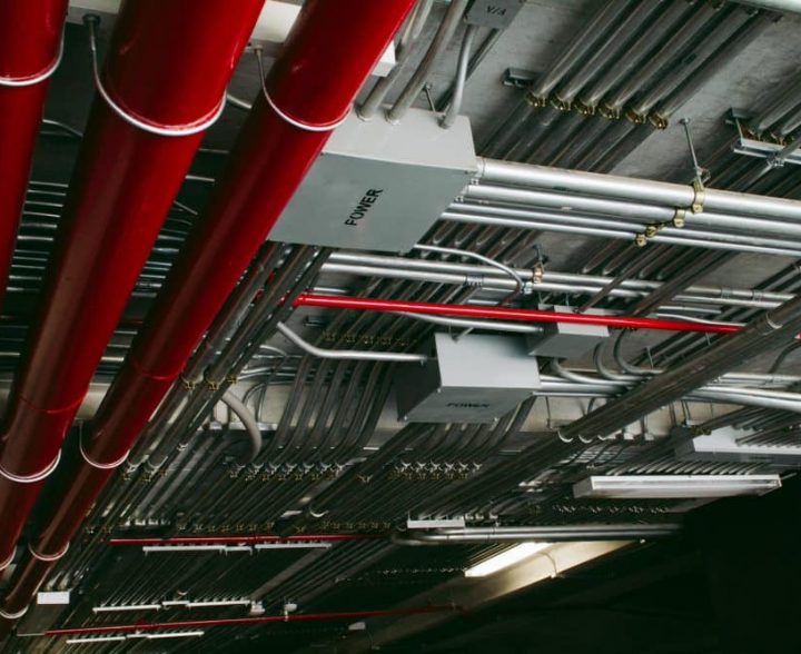 Electrical conduits system and metal pipeline installed on building ceiling