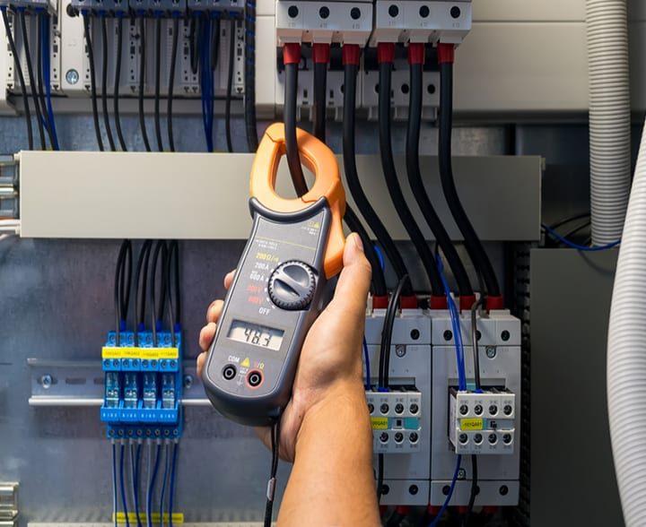 Technician measuring voltmeter – McGrath Electrical in South Grafton, NSW Technician measuring voltmeter - McGrath Electrical in South Grafton, NSW